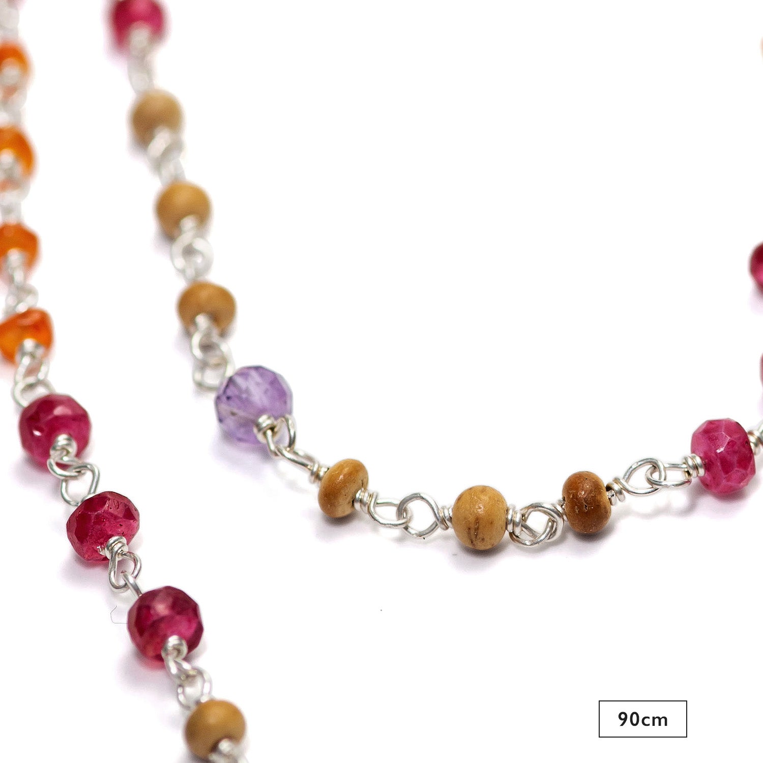 Detail of the 90cm gemstone necklace "Prana" made of high-quality sterling silver with rubies, carnelians, amethyst and sandalwood by Eternal Bliss