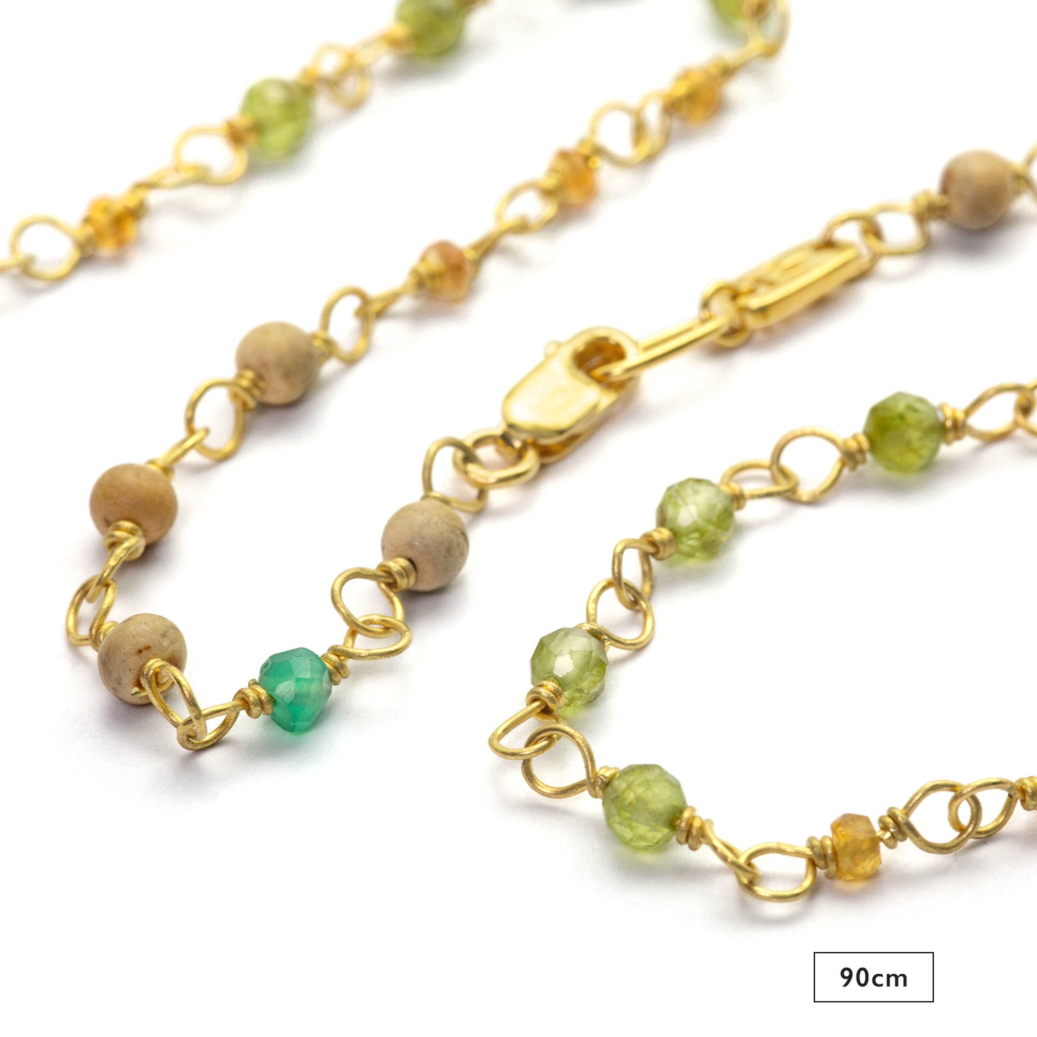 Detail of gemstone necklace "Inspiration" made of gold-plated sterling silver with emerald, sapphire, peridot and sandalwood by Eternal Bliss