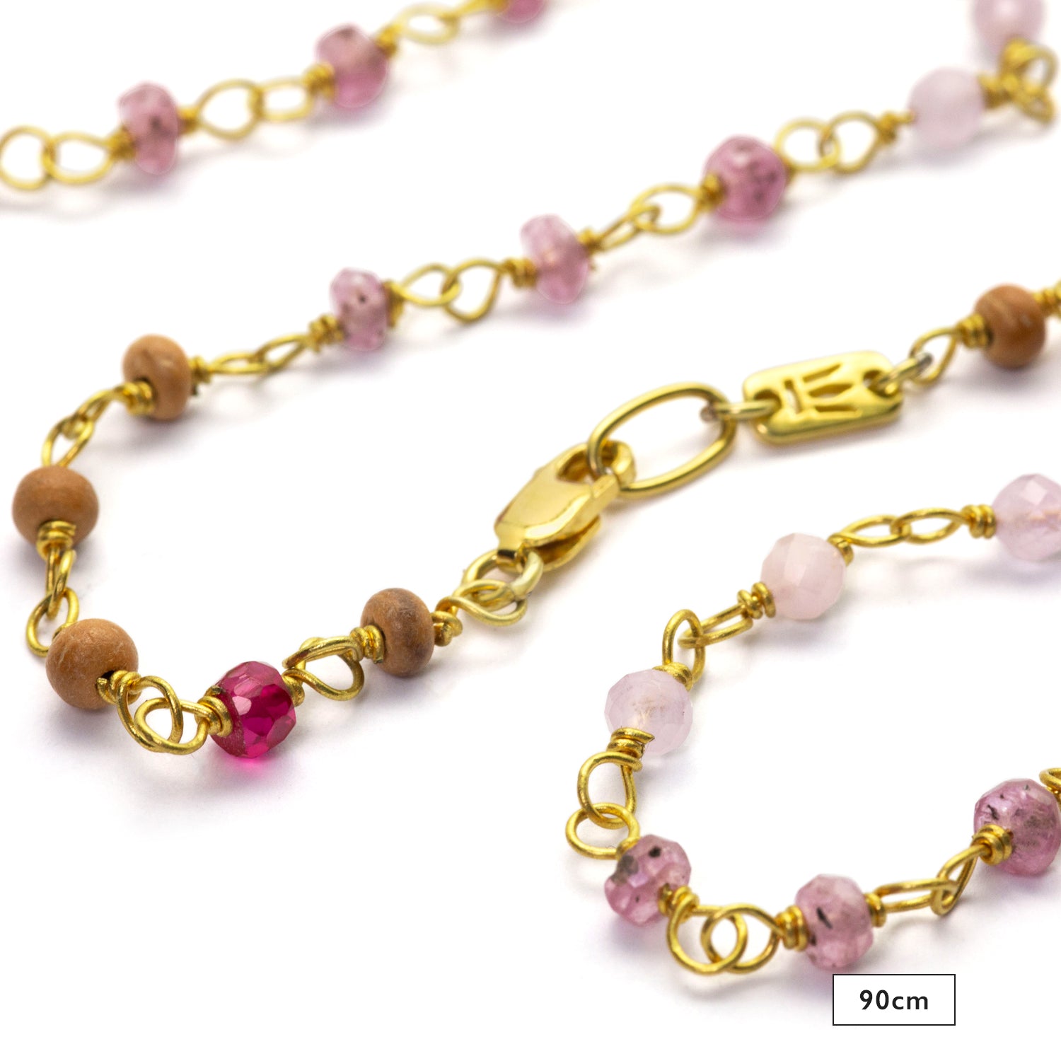 Detail of 90cm gemstone necklace "Sakura" made of high-quality gold-plated sterling silver with ruby, rock crystal, lavender, and sandalwood by Eternal Bliss