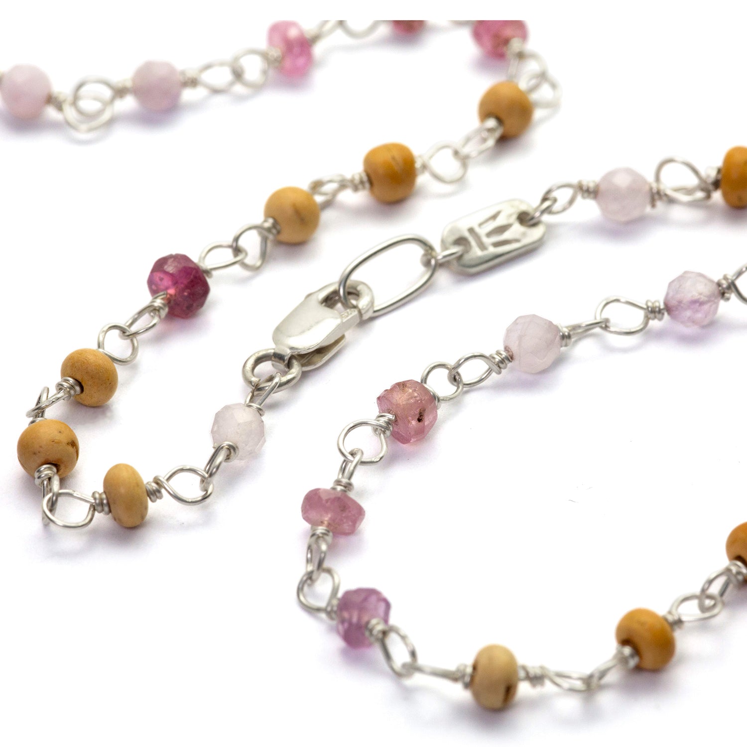 Detail of gemstone necklace "Sakura" made of high-quality sterling silver with ruby, rock crystal, lavender, and sandalwood by Eternal Bliss