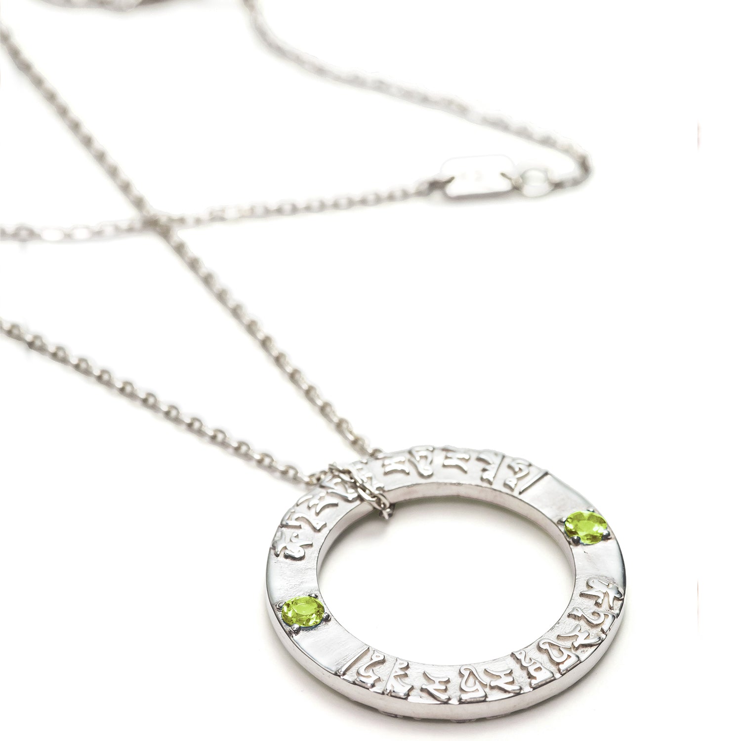 Tara mantra pendant made of high-quality sterling silver with peridot gemstones by ETERNAL BLISS from the Spiritual Yoga jewelry collection