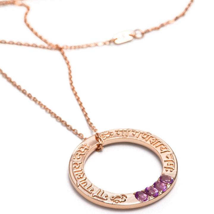 Ganesha Mantra pendant with raised Sanskrit writing in rose gold plated sterling silver and precious stones from ETERNAL BLISS from the spiritual yoga jewelery collection