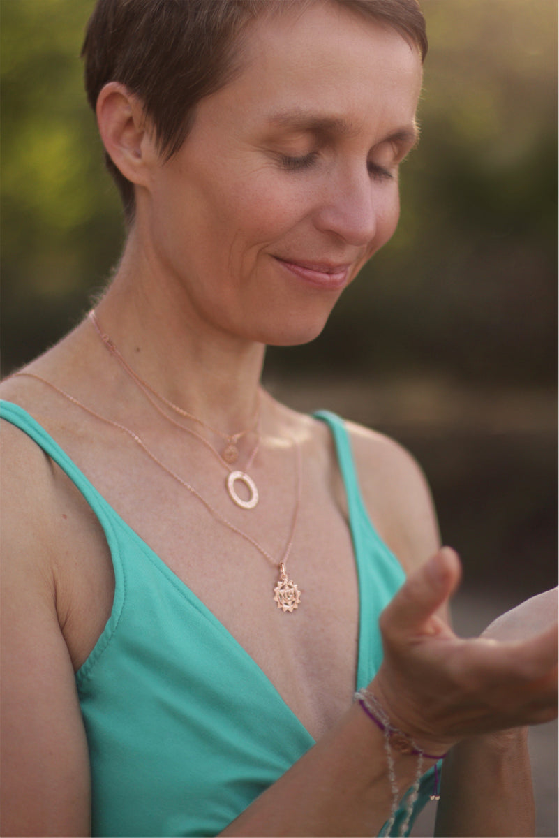 Spiritual jewelry collection: Annette Söhnlein, yoga teacher in Berlin, wears various necklaces from the Heart Chakra jewelry collection.